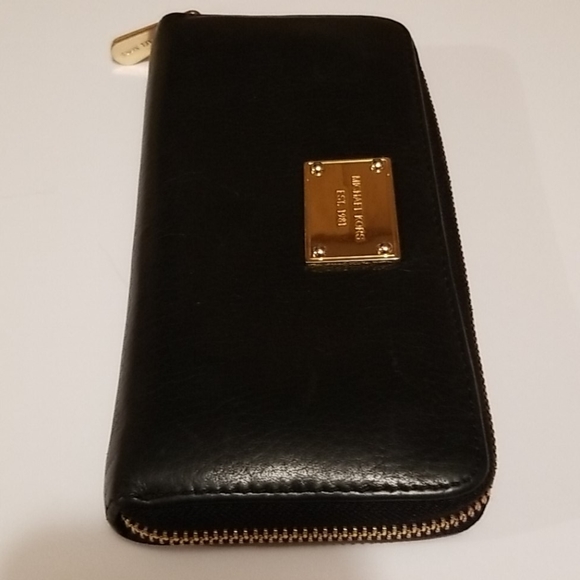 Michael Kors Handbags - Michael Kors Zip Around leather Wallet